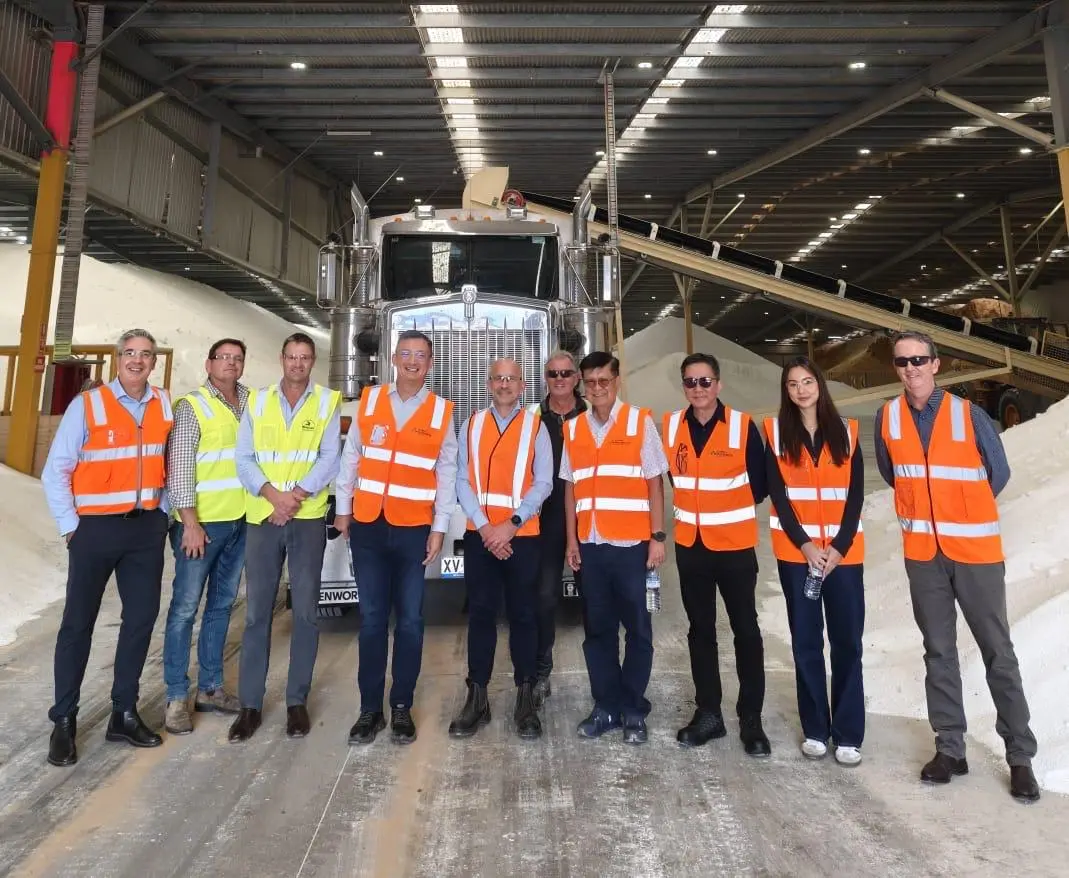 The Liven Nutrients Australia team in front of a truck inside the bulk fertiliser storage shed